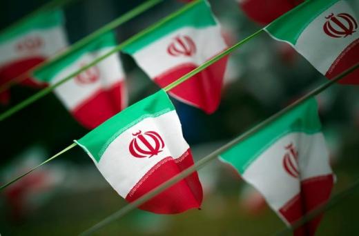 Iran's national flags are seen on a square in Tehran.
