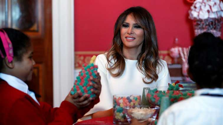 U.S. First Lady Melania Trump greets schoolchildren as she tours the holiday decorations with reporters at the White House in Washington