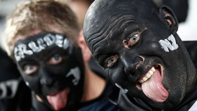New Zealand supporters celebrate their victory. Picture:REUTERS
