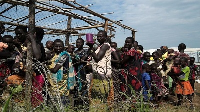 South Sudanese women and children queue to receive emergency food at the United Nations protection of civilians site 3 hosting about 30 000 people displaced during the recent fighting. Picture:REUTERS