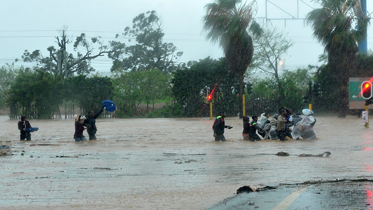 File Image: : DURBAN, SOUTH AFRICA  OCTOBER 10: (SOUTH AFRICA OUT): Residents rescue each other during severe floods on October 10, 2017 in Durban, South Africa. The heavy flash floods in KZN have claimed at least three lives, damaged five state hospitals and have flooded countless homes and buildings. (Photo by Jabulani Langa/Foto24/Gallo Images/Getty Images)