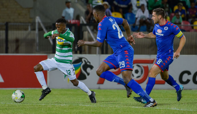 Bloemfontein Celtic midfielder Kabelo Mahlasela passes through SuperSport United players Morgan Gould and Dean Furman during the Absa Premiership match on Wednesday night at Dr Patrick Molemela Stadium.