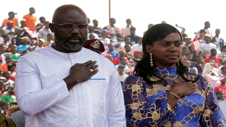 Liberia's new President George Weah stands with his wife Clar as they attend his swearing-in ceremony at the Samuel Kanyon Doe Sports Complex in Monrovia, Liberia January 22, 2018. REUTERS/Thierry Gouegnon