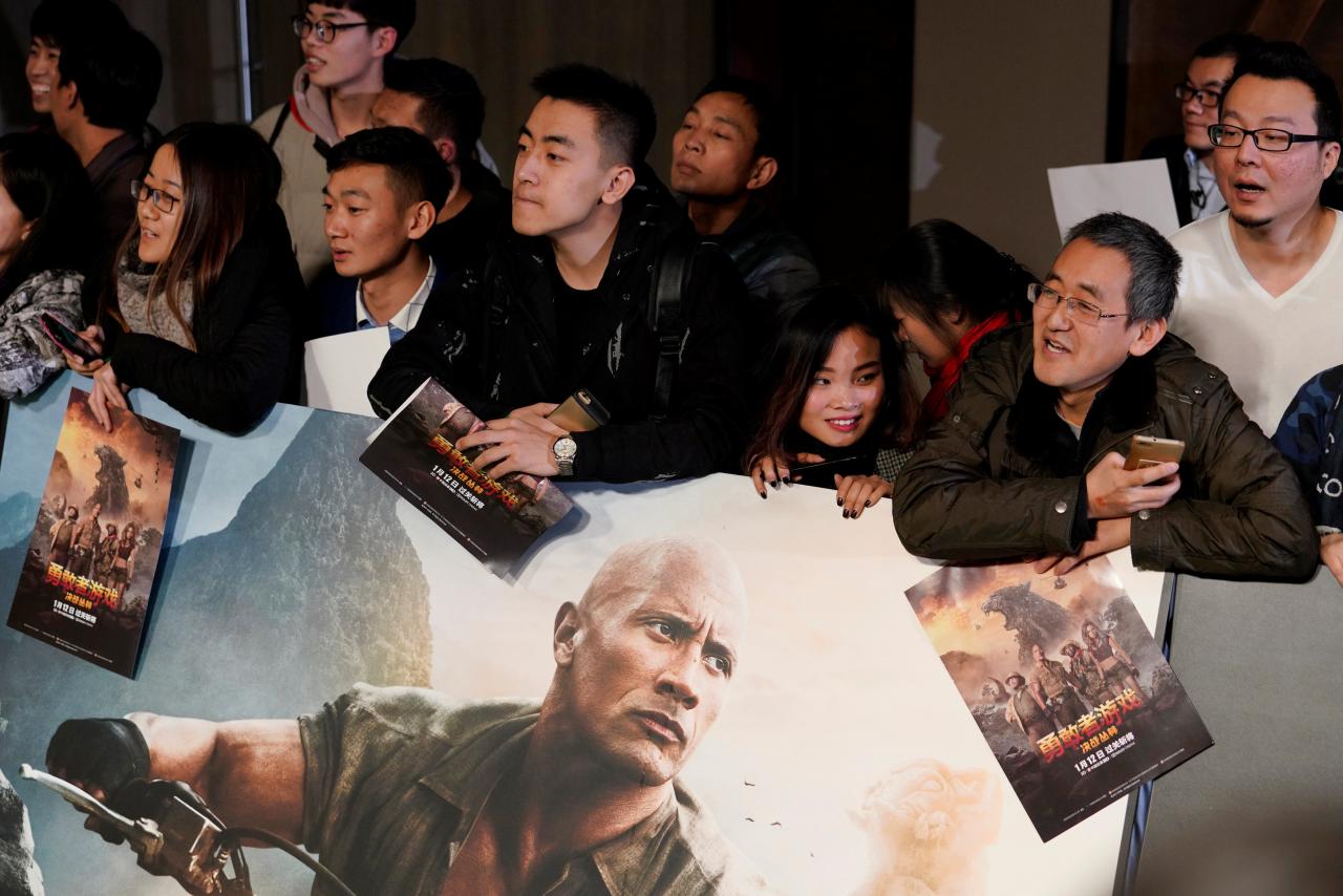 Fans wait for a red carpet event promoting actor Dwayne Johnson's new film "Jumanji: Welcome to the Jungle" in Beijing, China, January 4, 2018. REUTERS/Jason Lee