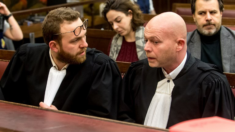Belgian lawyers representing Paris attacks suspect Salah Abdeslam Sven Mary and Romain Delcoigne speak together prior to the opening of the trial