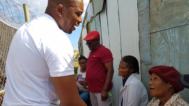 Maimane takes a moment with one of the elders in KwaDwesi , Port Elizabeth.