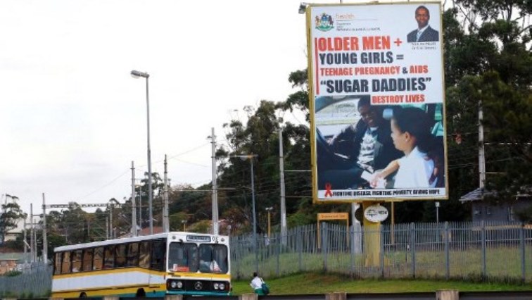 This picture taken on July 23, 2012 in Durban shows giant billboard highlighting the dangers for young women to have sex with older men. In South Africa, an increase in teenage pregnancies in eastern KwaZulu-Natal was blamed on older men seeking out younger women. The provincial government has set up 89 huge billboards to highlight the dangers of sex with older men, while creating support groups for young women to resist such relationships. AIDS experts say cross-generational sex, especially among older men and younger women, is one of the reasons that African women bear a greater burden of HIV infections, about 60 percent of cases in southern Africa. AFP PHOTO / RAJESH JANTILAL (TO GO WITH AFP STORY BY FELIX MPONDA)