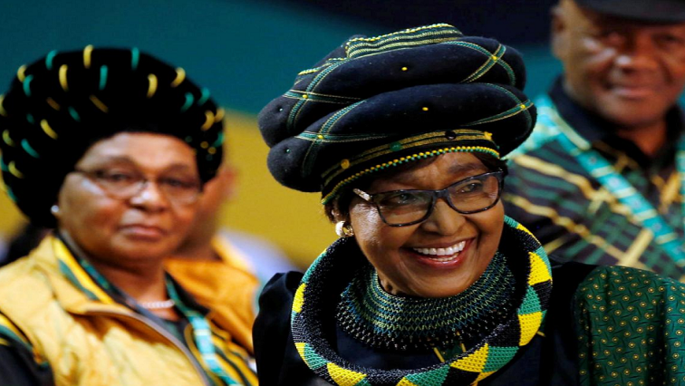 Winnie Madikizela-Mandela smiles as she arrives for the 54th National Elective Conference of the African National Congress at the Nasrec Expo Centre in Johannesburg.