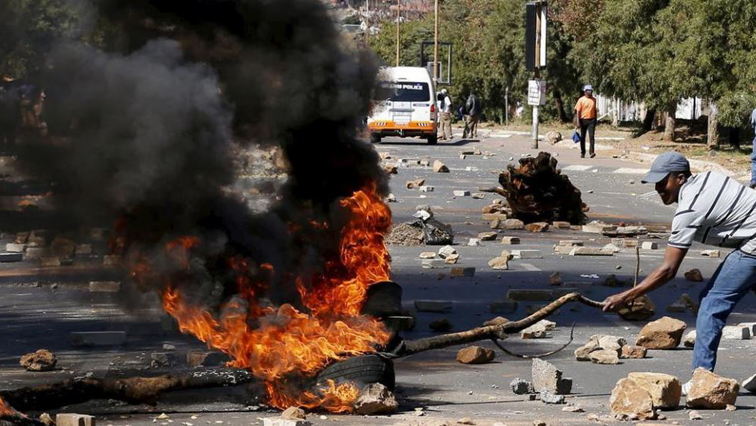 Residents are blocking the main road with stones and burning tyres.