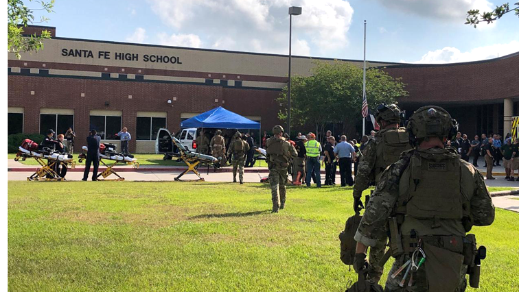 At least two of those injured were in critical condition, including a school police officer shot when he tried to take on the suspect, hospital officials said.