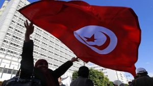Party supporter waves Tunisian flag