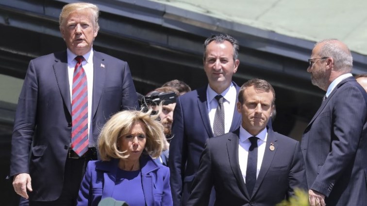 US President Donald Trump (L) and French President Emmanuel Macron (2nd R) with his wife Brigitte Macron arrive in La Malbaie, Quebec, Canada, June 8, 2018 on the first day of the G7 Summit.