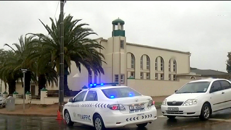 Police cars outside the mosque