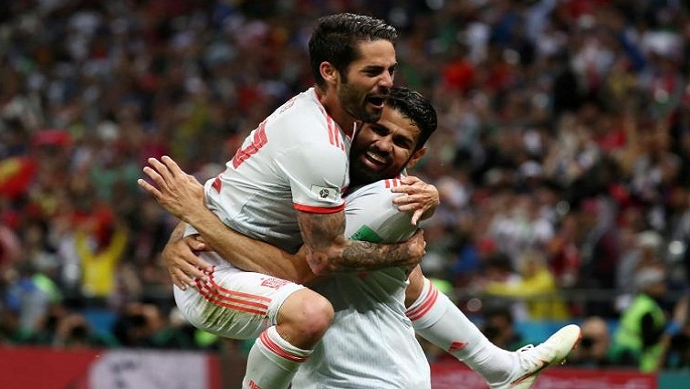 Spain's Diego Costa celebrates scoring their first goal with Isco.