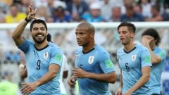 Uruguay's Luis Suarez celebrates scoring their first goal with team mates.