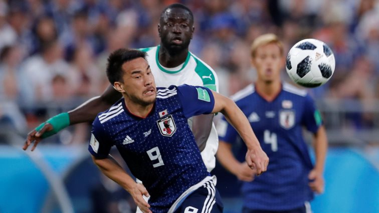 Japan's Shinji Okazaki in action with Senegal's Cheikhou Kouyate