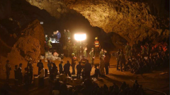People outside a cave.