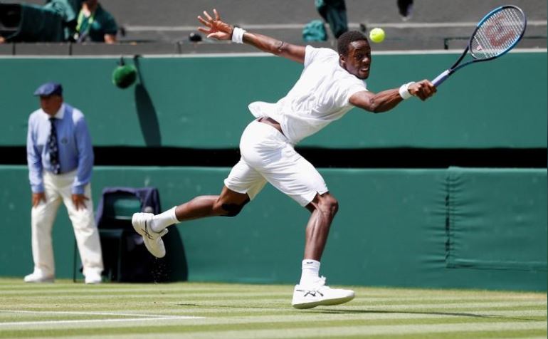 All England Lawn Tennis and Croquet Club, London, Britain - July 6, 2018. France's Gael Monfils hits a shot during his third round match against Sam Querrey of the U.S.