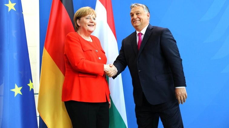 German Chancellor Angela Merkel (L) shakes hands with Hungarian Prime Minister Viktor Orban during a joint press conference following a meeting in Berlin.