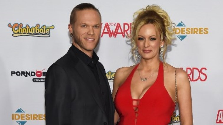 (FILES) This January 22, 2016 file photo shows adult film actor/musician Brendon Miller (L) and his wife, adult film actress/director Stormy Daniels, attending the 2016 Adult Video News Awards at the Hard Rock Hotel &amp