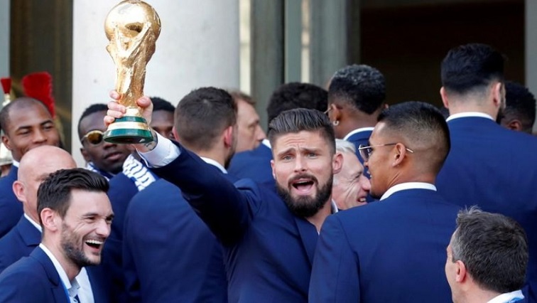 France player Olivier Giroud holds the trophy with team mates before a reception to honour the France soccer team after their victory in the 2018 Russia Soccer World Cup, at the Elysee Palace in Paris, France, July 16, 2018.