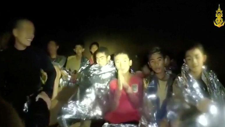Boys from the under-16 soccer team trapped inside Tham Luang cave greet members of the Thai rescue team in Chiang Rai, Thailand, in this still image taken from a July 3, 2018 video by Thai Navy Seal.