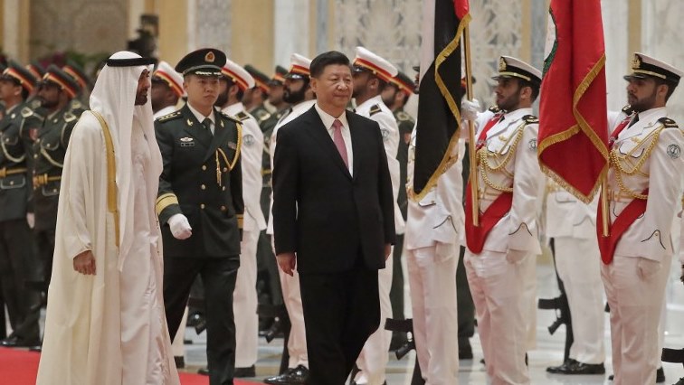 Chinese President Xi Jinping (R) and Crown Prince of Abu Dhabi Sheikh Mohamed bin Zayed Al Nahyan (L) review the honorary guards at the presidential palace in the UAE .