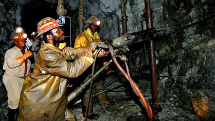 Mine workers in a mine