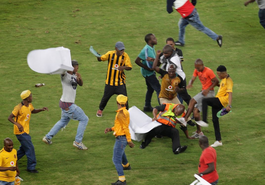 Violent and chaotic scenes were seen at the stadium after fans stormed the pitch.