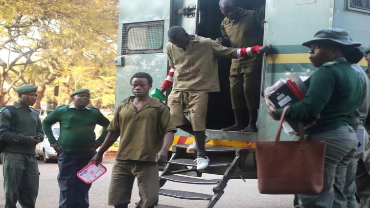 MDC supporters arrested last week stepping out of police truck