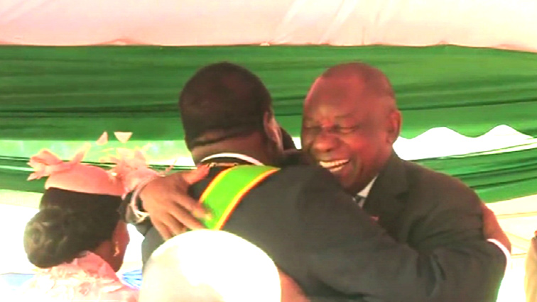 Ramaphosa and Mnangagwa hugging
