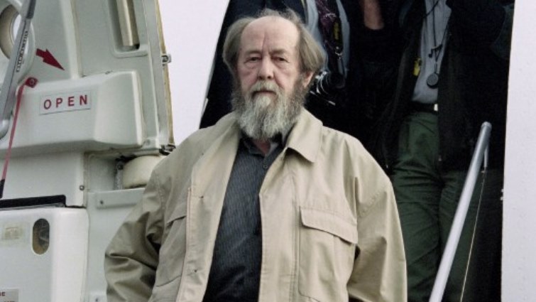 (FILES) In this file photograph taken on May 27, 1994, Russian writer Alexander Solzhenitsyn arrives at Vladivostok Airport, following 20 years of exile.