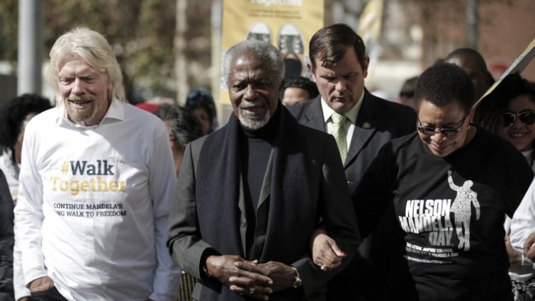 (L to R) English businessman Richard Branson, former secretary-general of the United Nations Kofi Annan, and former South African first lady and widow of Nelson Mandela Graca Michel walk during The Elders walk.