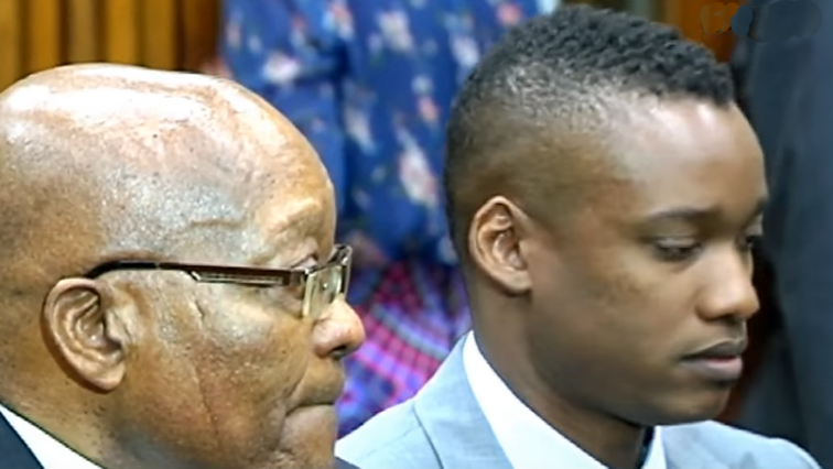 Former President Jacob Zuma sitting with his son Duduzane Zuma in court