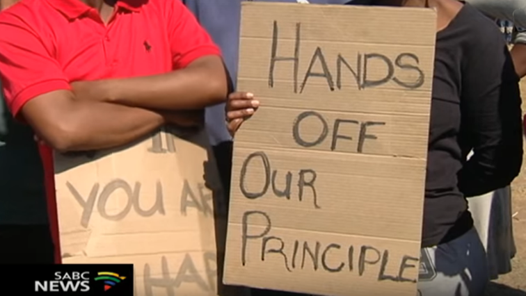 Protesting parents with placards
