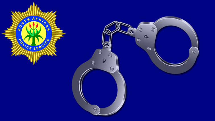 SAPS badge and handcuffs