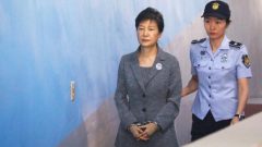 Park Geun-hye handcuffed by police officer