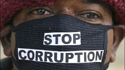 A man with a mouth mask written stop corruption