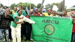 Amcu members holding a banner
