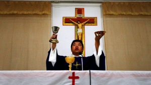 A Chinese Catholic priest at the altar