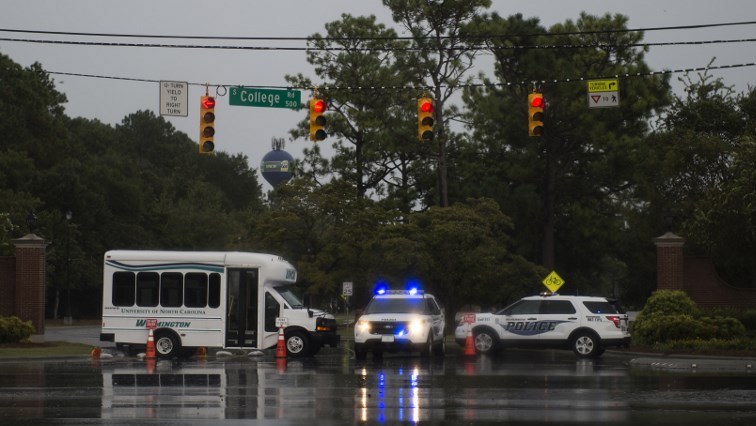 Police block a road as rain from Hurricane Florence falls in Wilmington, North Carolina.