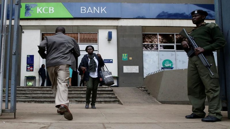 Customers are seen outside the banking hall at the Kenya Commercial Bank (KCB), Kencom branch in Nairobi, Kenya July 10, 2018.