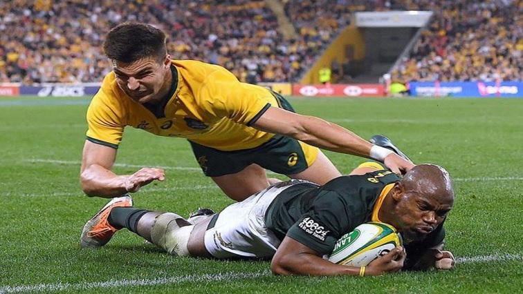 Australia's Jack Maddocks fails to stop South Africa's Makazole Mapimpi from scoring a try.