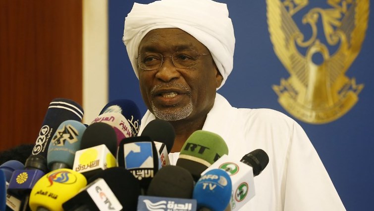 Sudan's newly appointed vice-president Mohamed Osman Yousif Kiber addresses journalists after taking the oath in Khartoum.