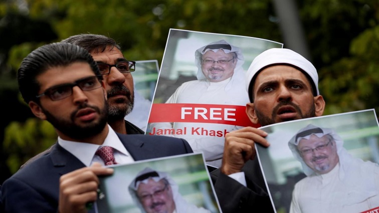 FILE PHOTO: Human rights activists and friends of Saudi journalist Jamal Khashoggi hold his pictures during a protest outside the Saudi Consulate in Istanbul, Turkey October 8, 2018.