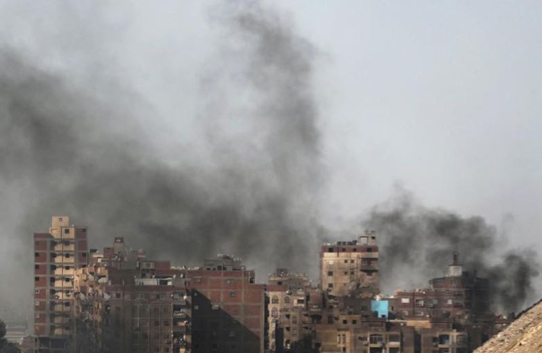 Smoke coming from burning rubbish rises near buildings in Cairo, Egypt October 30, 2018.