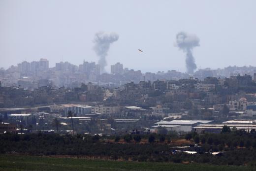 Smoke rises following an Israeli air strike in the Gaza Strip, as seen from the Israeli side of the border between Israel and Gaza.