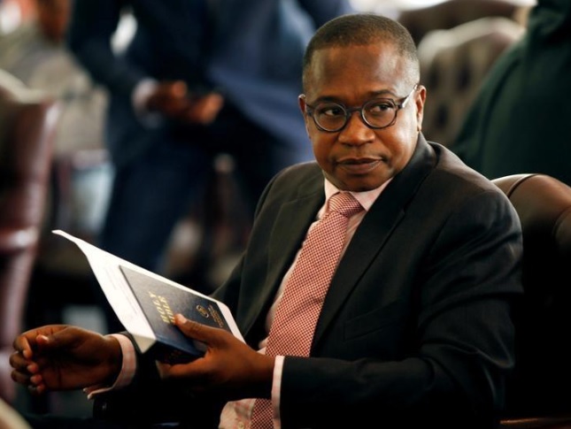 Zimbabwean Finance Minister Mthuli Ncube looks on before the swearing in of new cabinet ministers at State House in Harare, Zimbabwe, September 10, 2018.