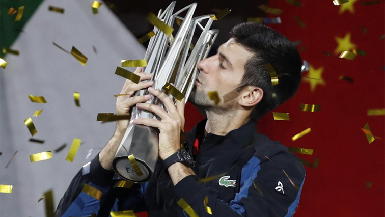 Novak Djokovic kissing his trophy