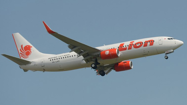 This file photo taken on March 18, 2013 shows a Lion Air plane flying over Sukarno-Hatta airport in Tangerang, outside Jakarta. An Indonesian Lion Air passenger plane went missing on October 29, 2018 shortly after taking off from the capital Jakarta, an aviation authority official said, adding that a search and rescue operation is under way.